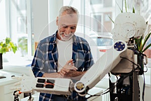 Happy nice man enjoying new technology