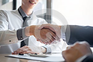 Successful job interview, Boss employer in suit and new employee shaking hands after negotiation and interview, career and
