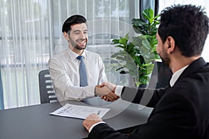 Successful job interview at business office with handshake. Fervent