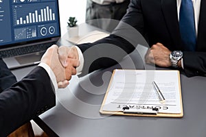 Successful job interview at business office with handshake. Fervent