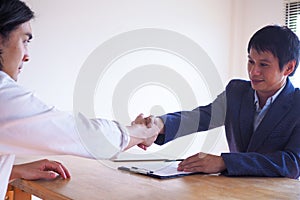 Successful job interview. Executives are willing to accept applicants to work, hand in hand between executives and new em