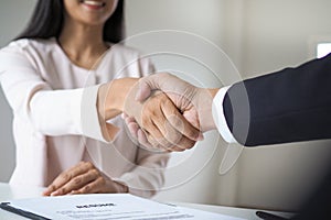 Successful job interview. Executives are willing to accept applicants to work, hand in hand between executives and new employee