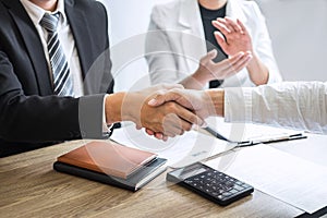 Successful job interview, Image of Boss employer committee or recruiter in suit and new employee shaking hands and clap after good