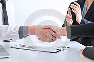 Successful job interview, Image of Boss employer committee or recruiter in suit and new employee shaking hands and clap after good