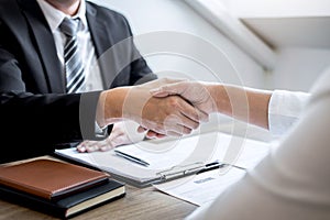 Successful job interview, Image of Boss employer committee or recruiter in suit and new employee shaking hands after good deal