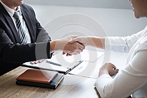 Successful job interview, Image of Boss employer committee or recruiter in suit and new employee shaking hands after good deal