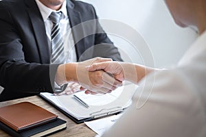 Successful job interview, Image of Boss employer committee or recruiter in suit and new employee shaking hands after good deal