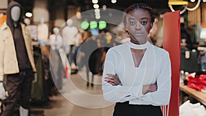 Successful lady small business woman african american girl female salesman clothing store owner stands at entrance to