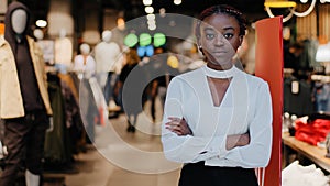 Successful lady small business woman african american girl female salesman clothing store owner stands at entrance to