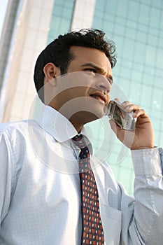 Successful man doing business on mobile phone