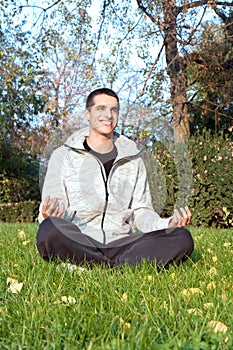 Successful man finding peaceful freedom in park