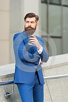 Successful man owner of business company has coffee break. handsome guy wear expensive office jacket. morning