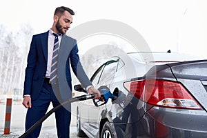 Successful Man Refueling Car