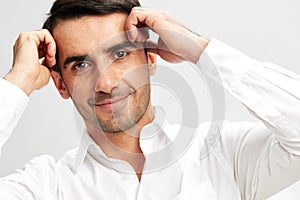 successful man in a white shirt a pensive look self-confidence isolated background
