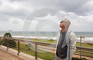 Successful matur man on the background of the sea