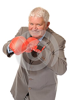 Successful mature businessman boxing