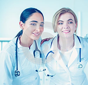 Successful medical team. Confident doctors team standing together and smiling