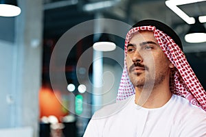 Successful muslim businessmen in traditional outfit in his office