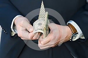 Successful rich businessman counts money. hands hold american dollars. financial airbag. cash payment