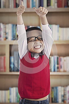 Successful schoolboy in library