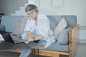 Successful senior mature retired woman lawyer or businesswoman working remotely from country house