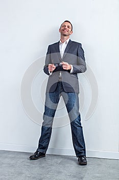 Successful serene handsome 40s businessman for modern corporate portrait