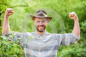 Successful sexy farmer. muscular ranch man in cowboy hat care plants. farming and agriculture. Gardening ranch. Eco farm