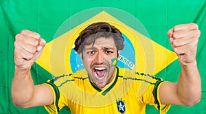 Successful Sportsman Shouting Against Brazilian Flag