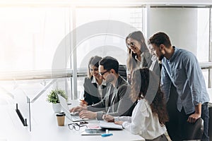 Successful team. Group of young business people working and communicating together in creative office