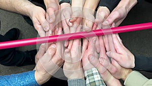 Successful team in office many hands holding together. Team building concept.