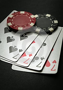 Successful win with four playing cards. Poker game with four of a kind or quads combination