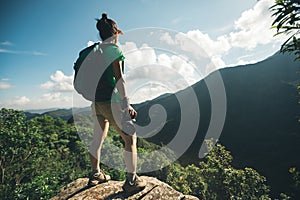 woman hiker taking photo on hiking travel photo