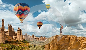 Successful woman and hot air balloon Concept motivation, inspiration