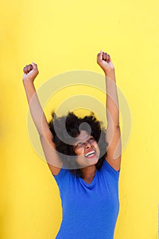 Successful woman smiling with arms outstretched