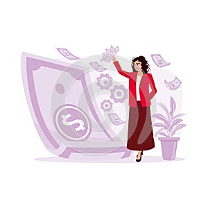 Successful woman standing and holding many dollar banknotes in hand. Earning Money concept.