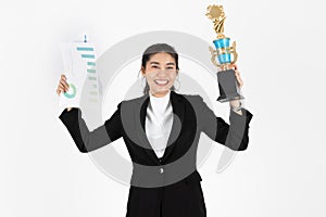 Successful young Asian business woman celebrating with trophy award over white isolated background. Success achievement in