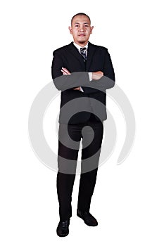 Successful young bald Asian businessman wearing suit smiling confidence looking at a camera, crossed arm, full body portrait