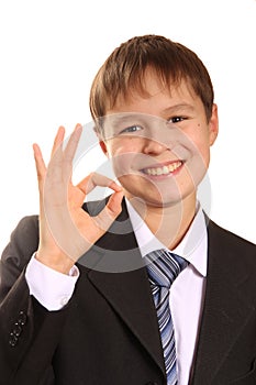 Successful young boy showing Ok sign