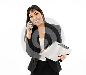 Successful young business woman talking on phone holding a folder. Isolated on white background