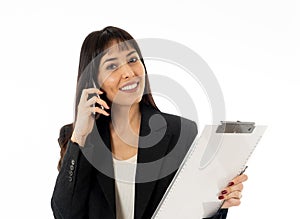 Successful young business woman talking on phone holding a folder. Isolated on white background