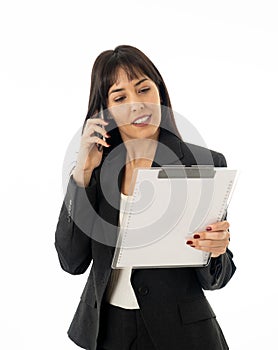 Successful young business woman talking on phone holding a folder. Isolated on white background