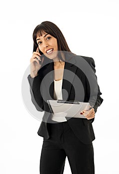 Successful young business woman talking on phone holding a folder. Isolated on white background