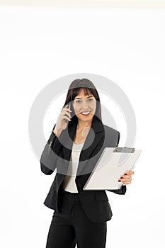 Successful young business woman talking on phone holding a folder. Isolated on white background