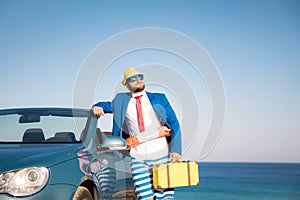 Successful young businessman on a beach