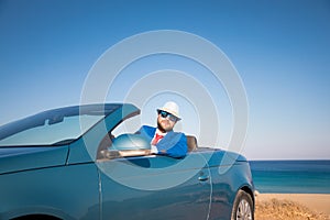 Successful young businessman on a beach