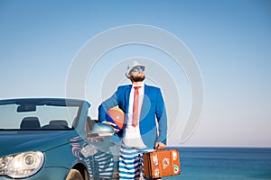 Successful young businessman on a beach