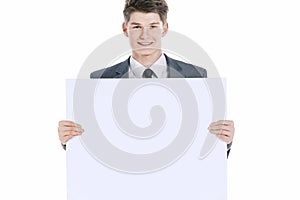 Successful young businessman with blank banner.isolated on a white