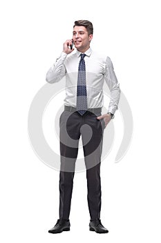 Successful young businessman talking on mobile phone. isolated on white