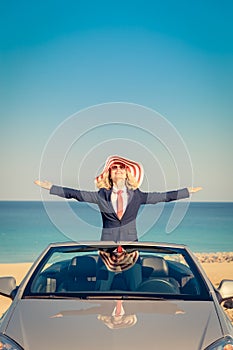 Successful young businesswoman on a beach