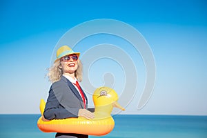 Successful young businesswoman on a beach